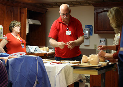 Picture of a male and two females.