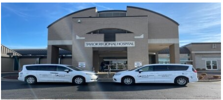 two van in front of the hospital entrance